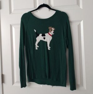 A sweater with a dog on it.